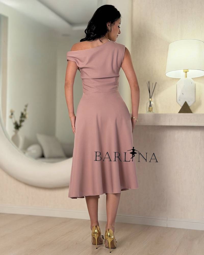 A pink midi dress with an elegant and soft design.