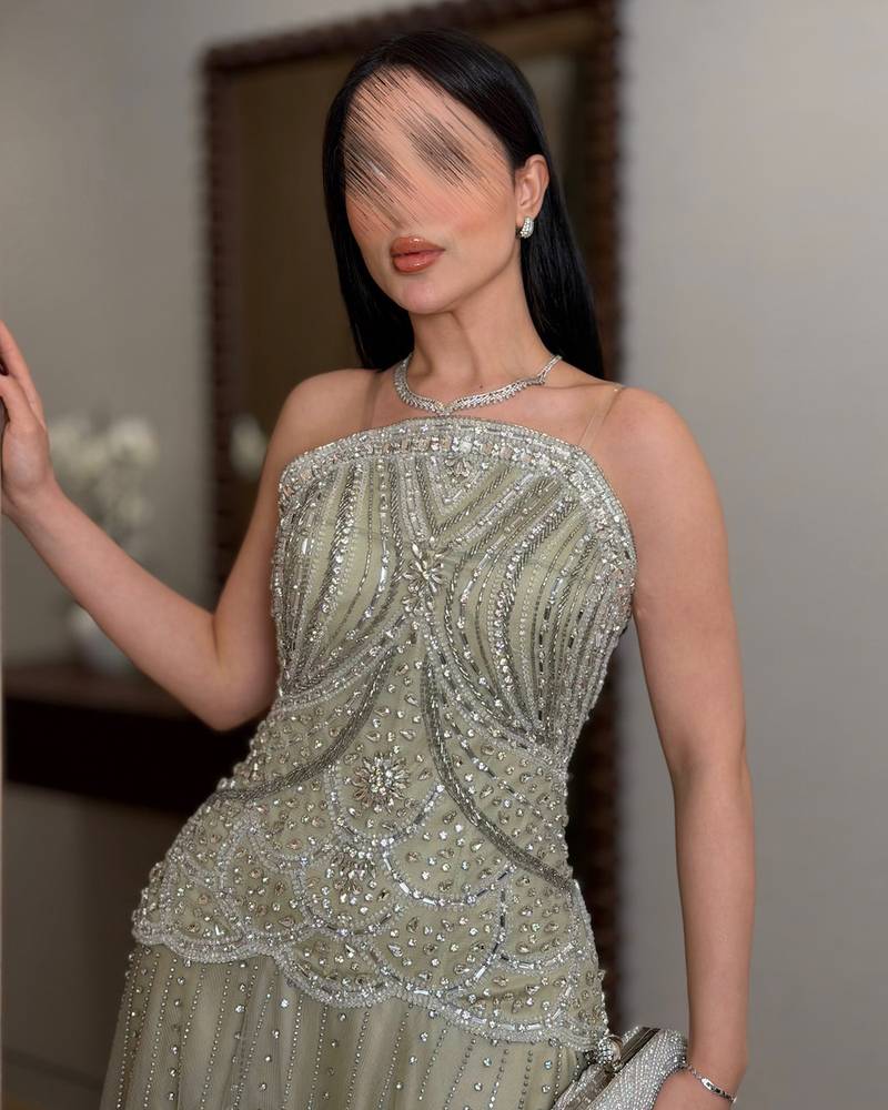 Elegant evening dress adorned with sequins and layers of tulle