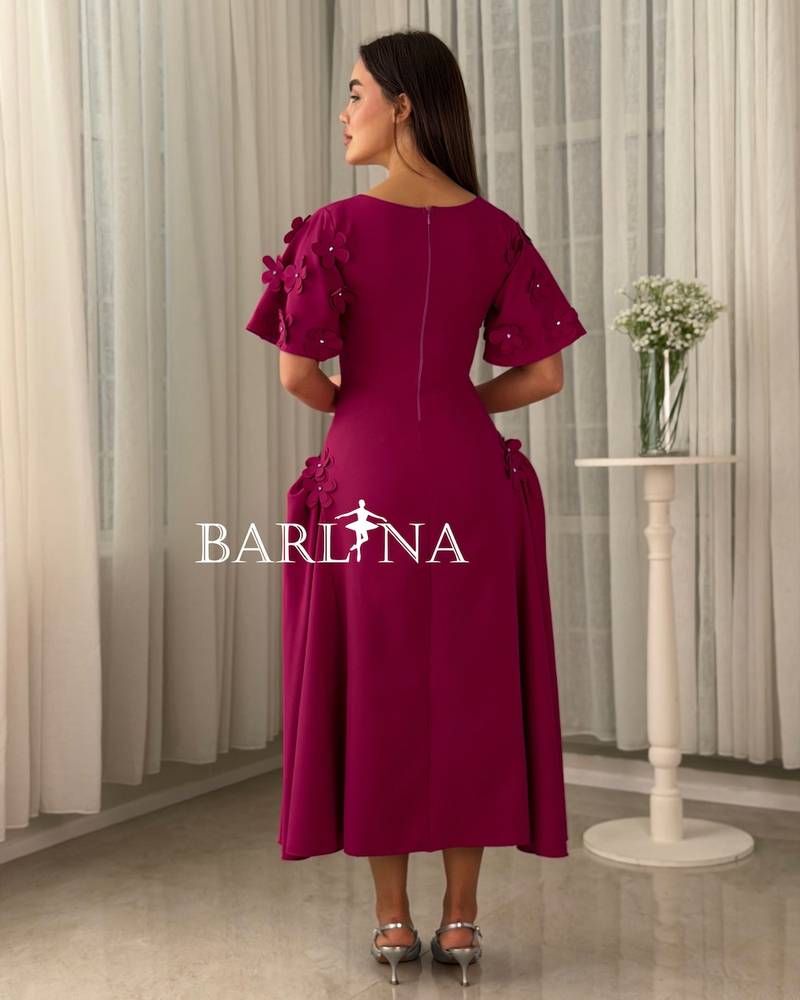Fuchsia fitted dress adorned with roses