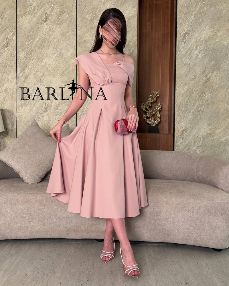 Light pink midi dress with a defined waist