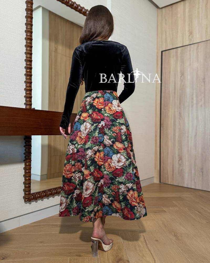 A velvet blouse with a floral skirt