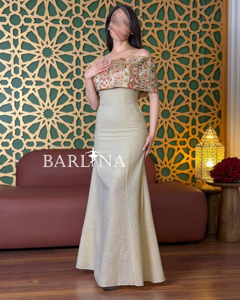 Beige off-shoulder dress with colorful heritage embroidery