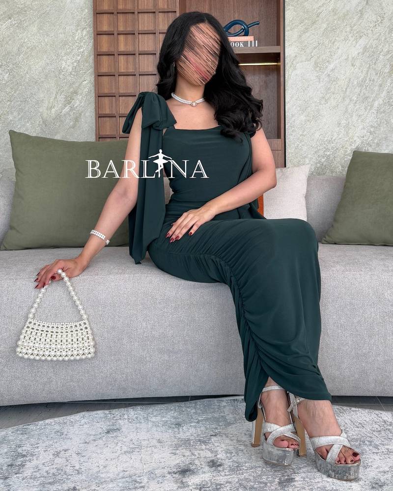 Dark green dress with bow on the shoulders
