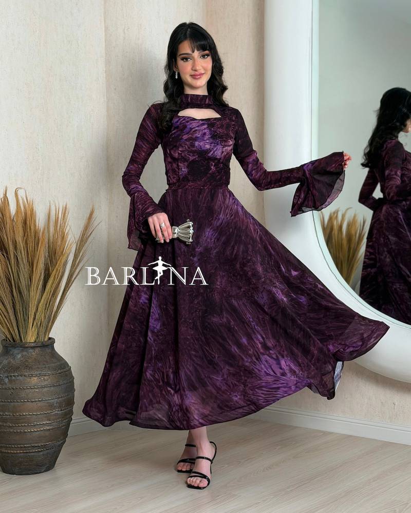 Purple dress with long sleeves and a plunging neckline