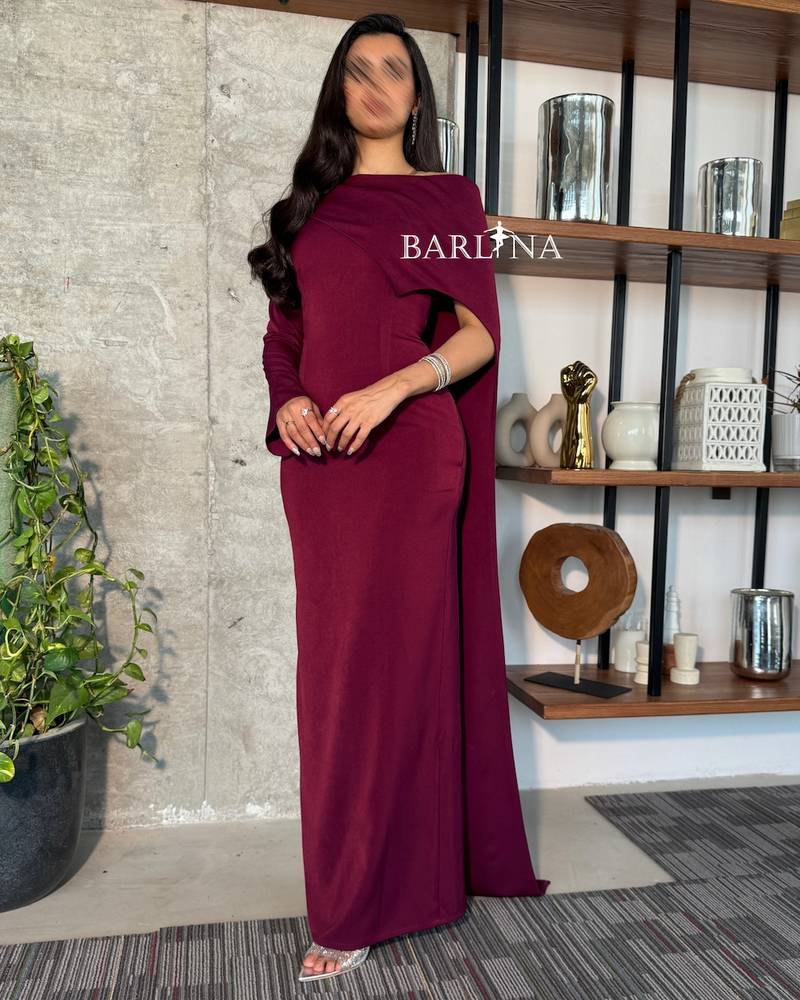 Burgundy dress with a long asymmetrical cape