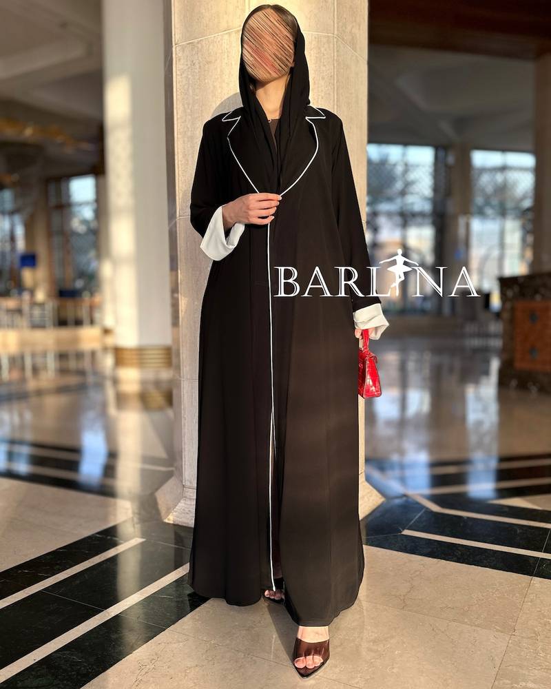 Black abaya with prominent white details