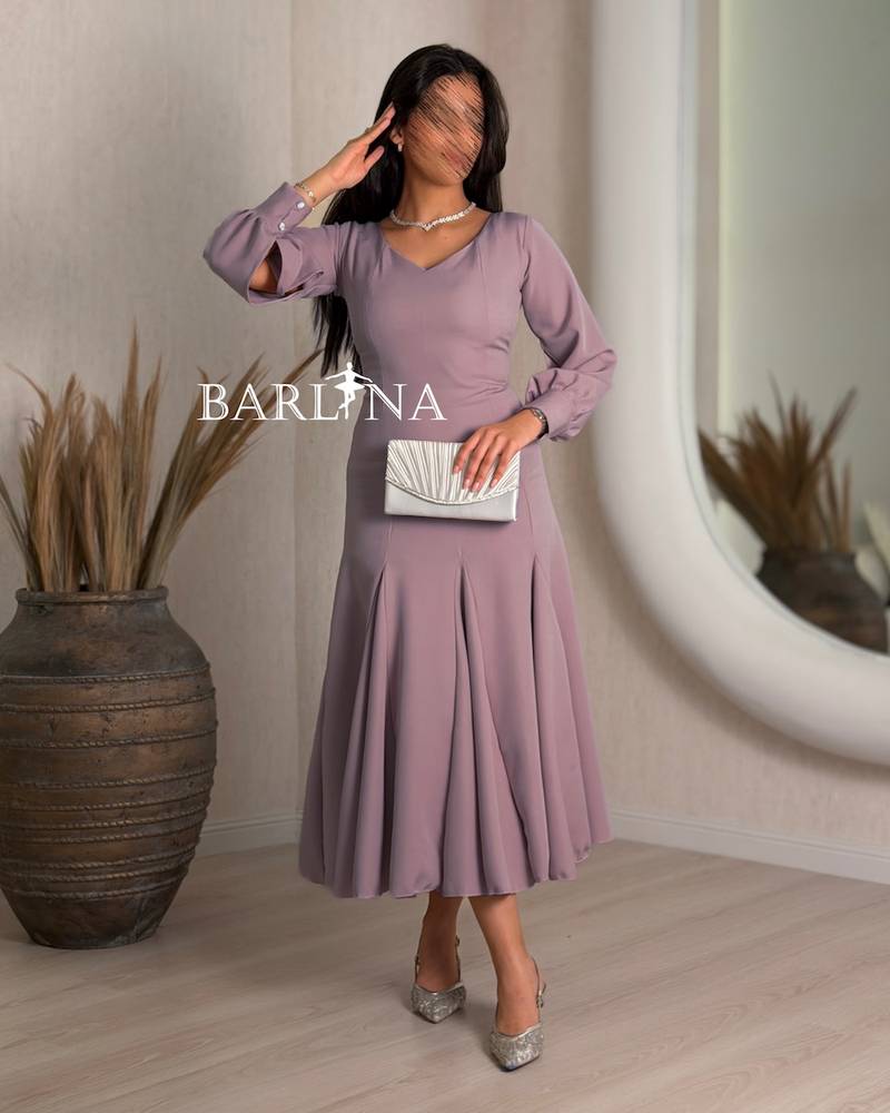 mauve dress with a V-neck and wide pleats