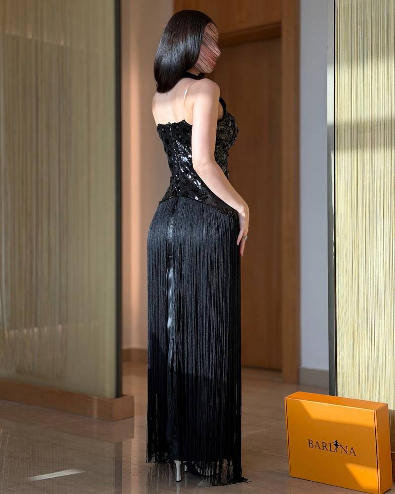 Black evening dress with shimmering sequins and long fringe