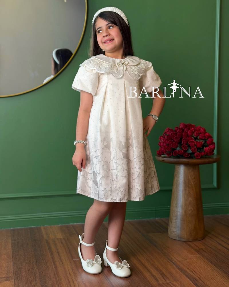 A short girl's dress decorated with delicate embroidery