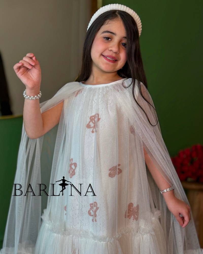 white girl's dress with wide tulle sleeves