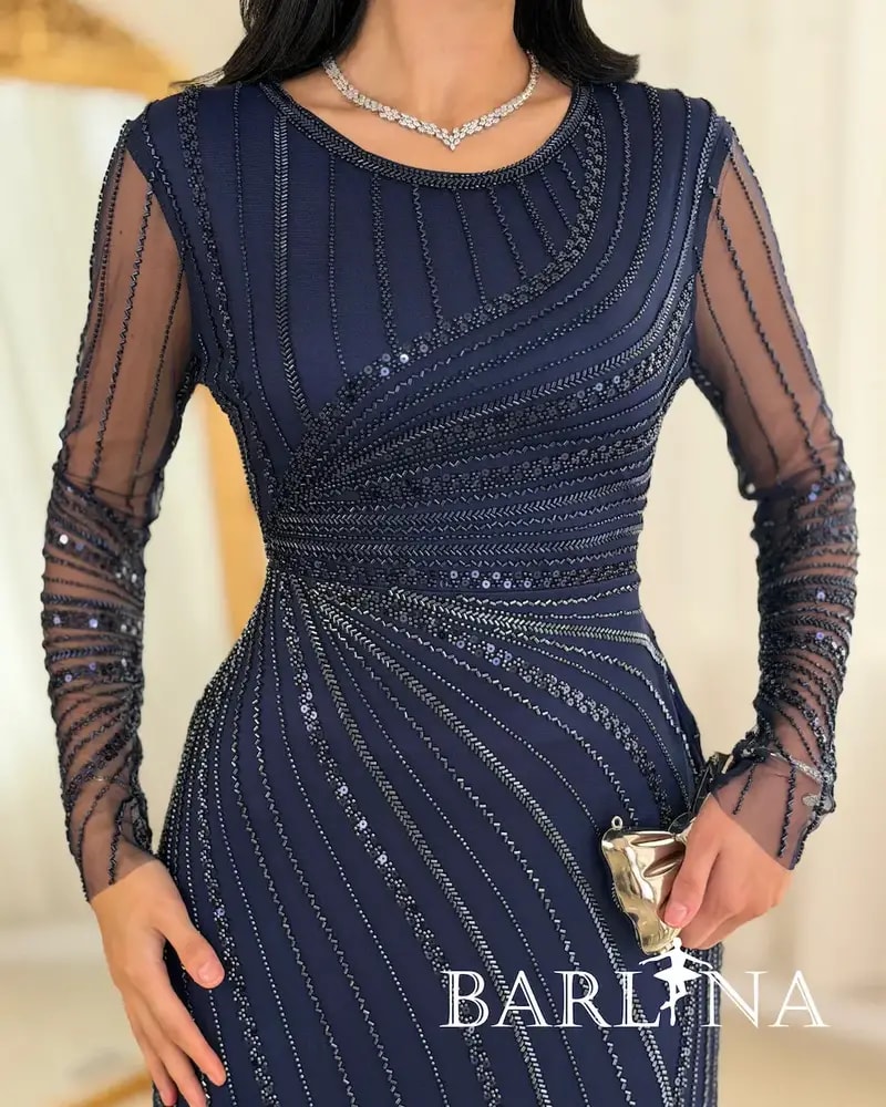 Elegant evening dress adorned with shimmering embroidery lines