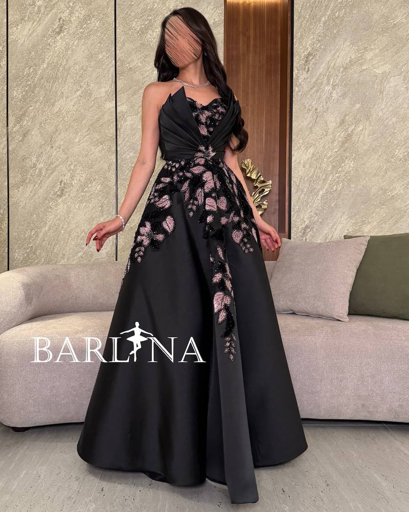 Elegant black evening dress with pleats at the chest