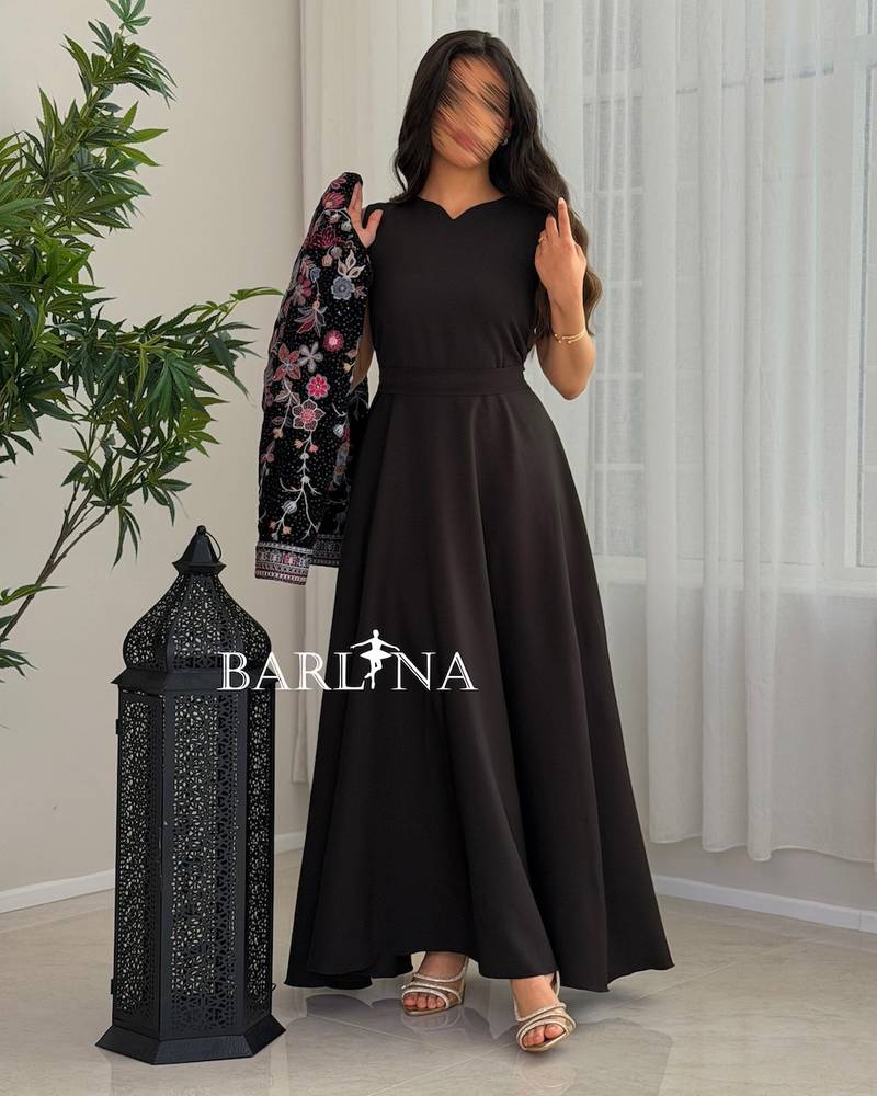 Black jalabiya with a short embroidered jacket