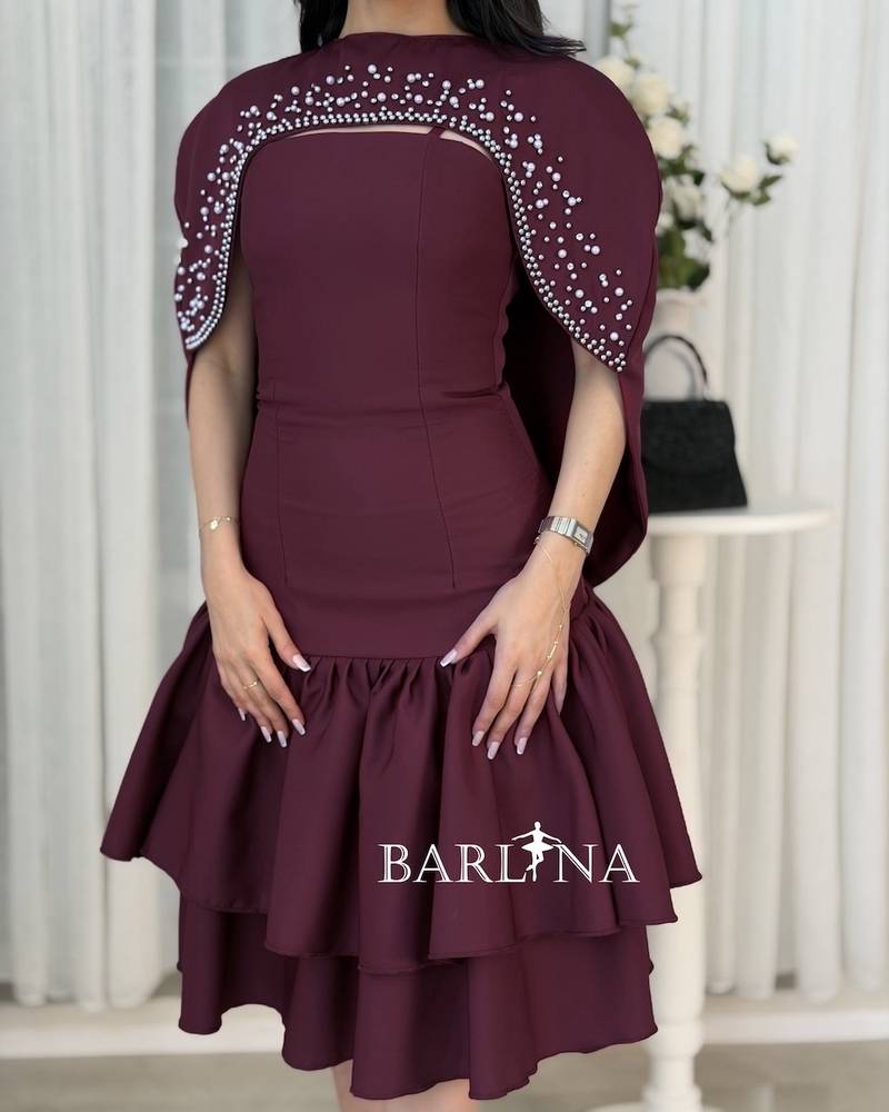 A short dress adorned with pearl details