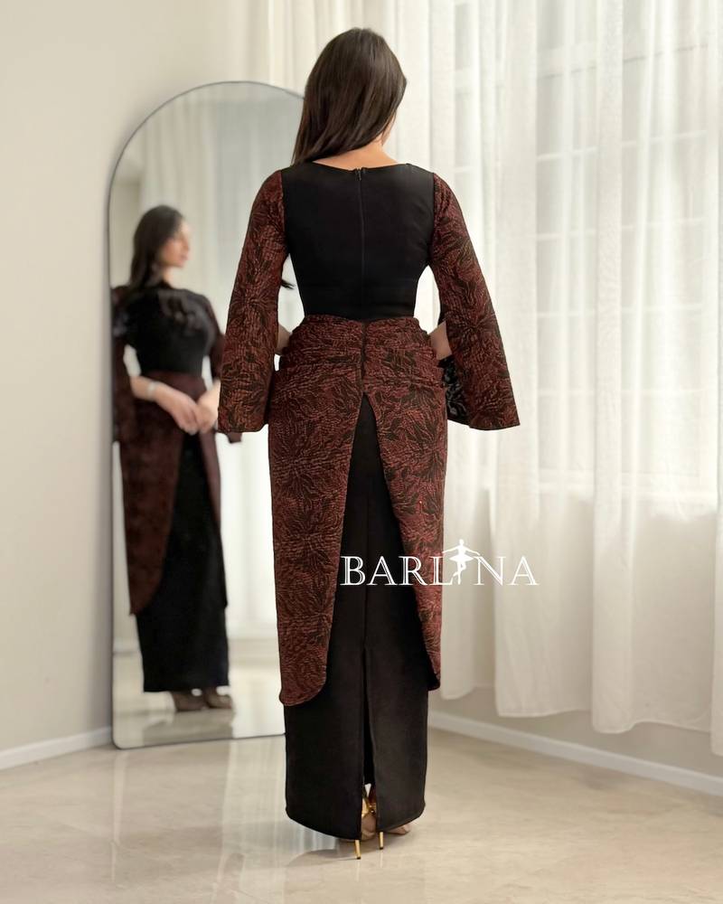 Black dress with a burgundy pattern on the sleeves and waist