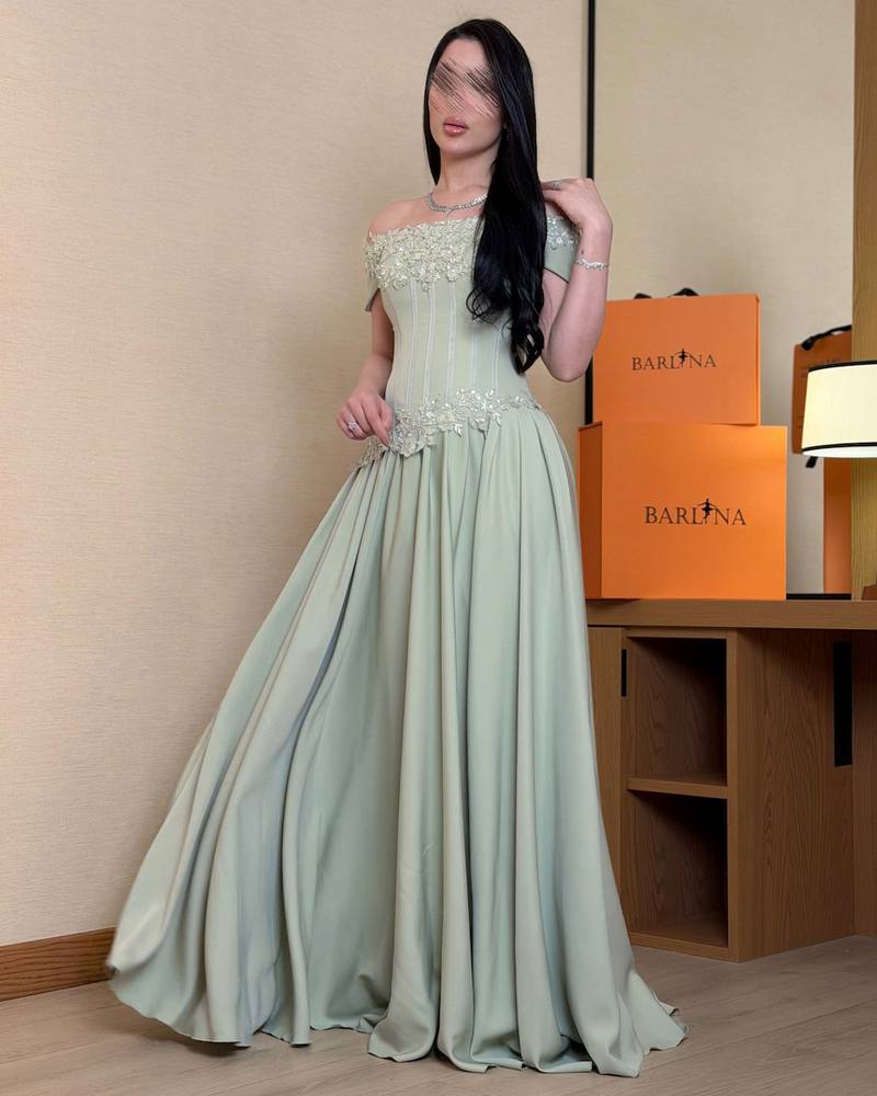 Luxurious light green off-the-shoulder evening dress