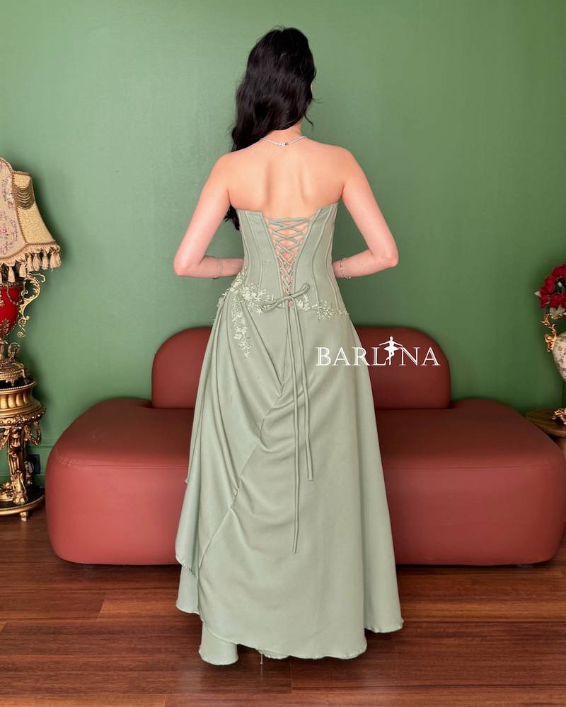 Pistachio green dress with a gathered waist design