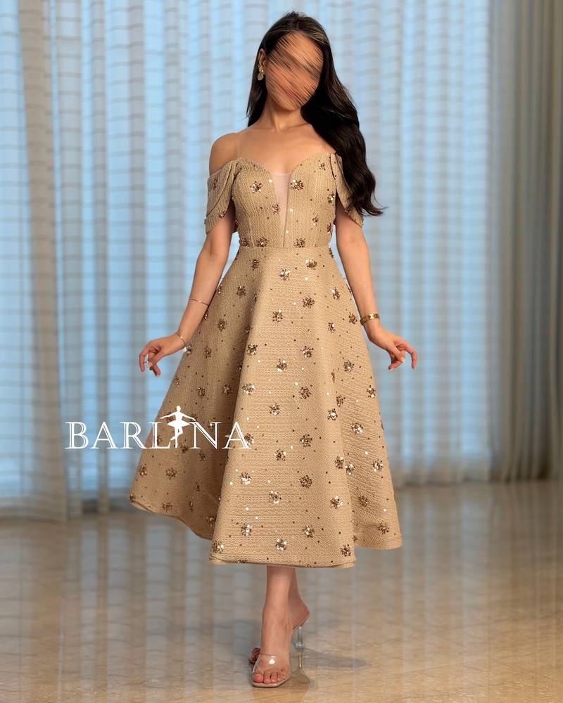 Beige midi dress embellished with gold sequins