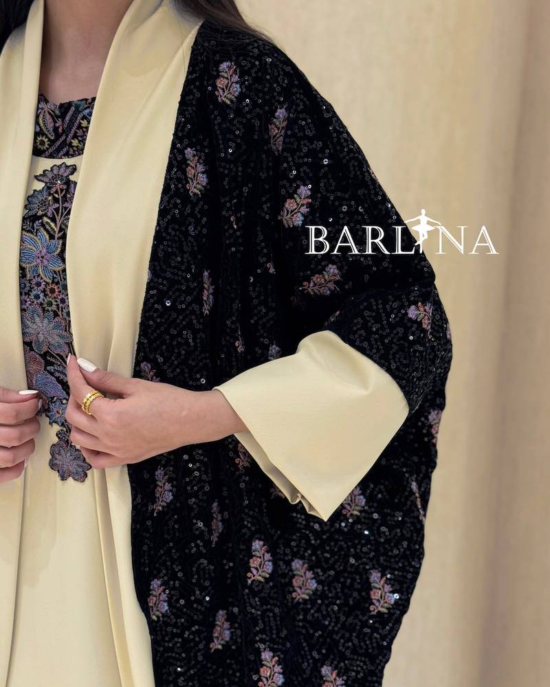 Beige jalabiya with a black floral jacket
