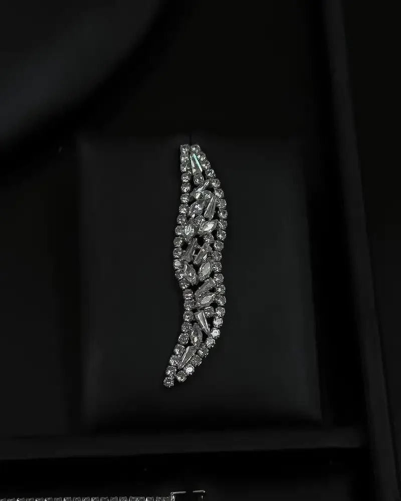 An accessory set with a streamlined asymmetrical design.