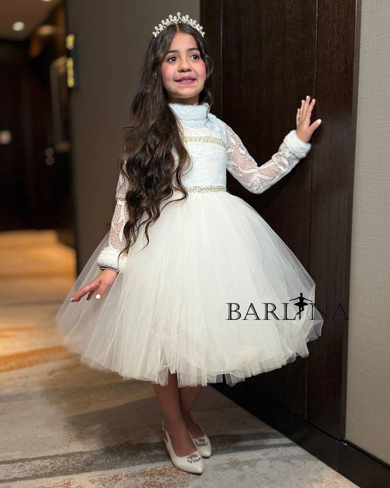 White girl's dress with a high neck and fluffy tulle