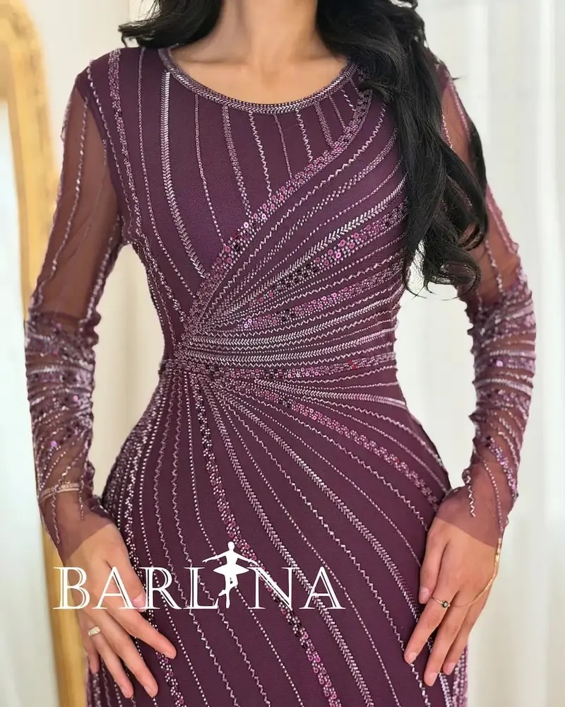 Elegant evening dress adorned with shimmering embroidery lines