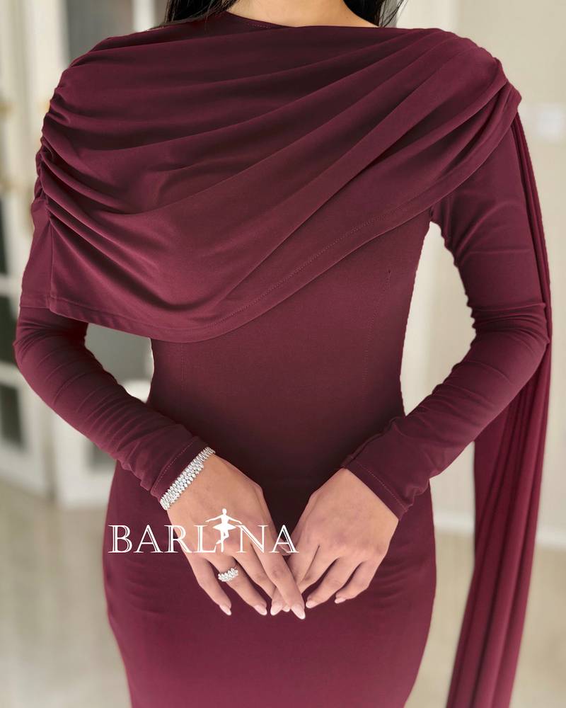 A soft burgundy dress with a wrap-around drape on the chest