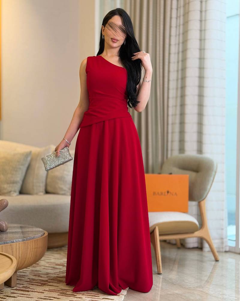 Elegant red one-shoulder dress with a defined waist