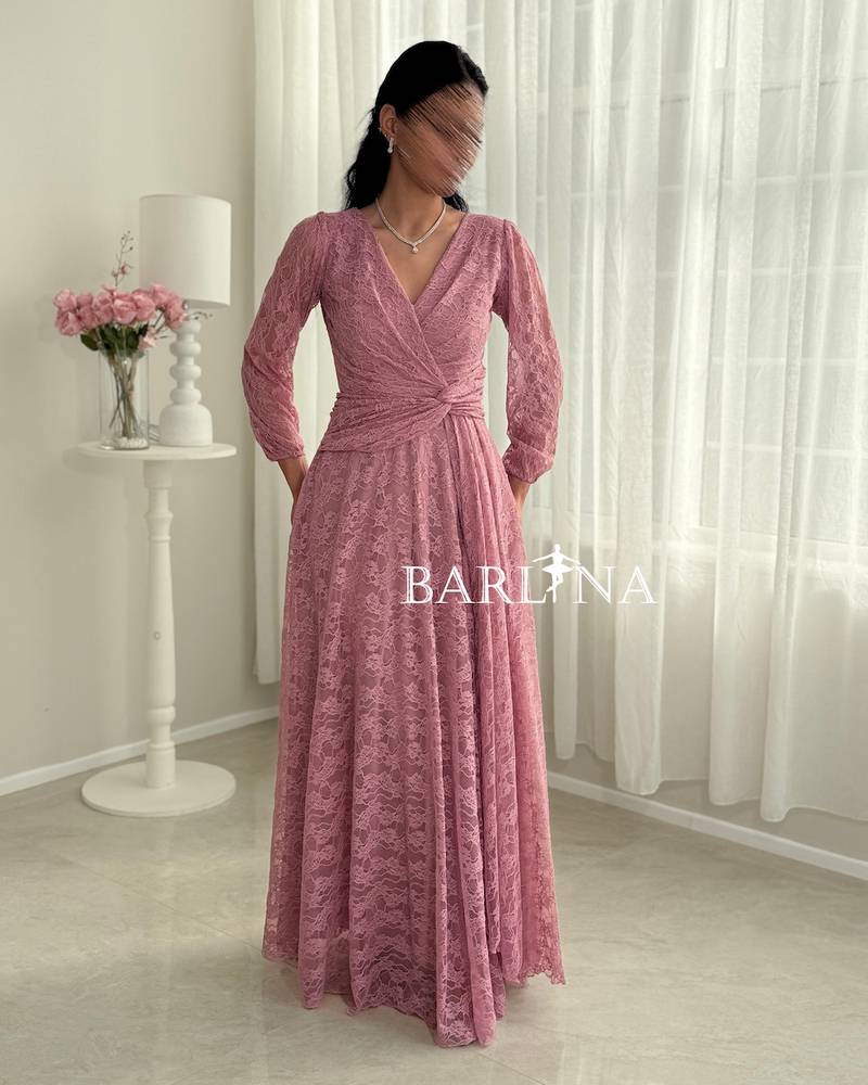 Pink lace dress with a crisscross wrap design