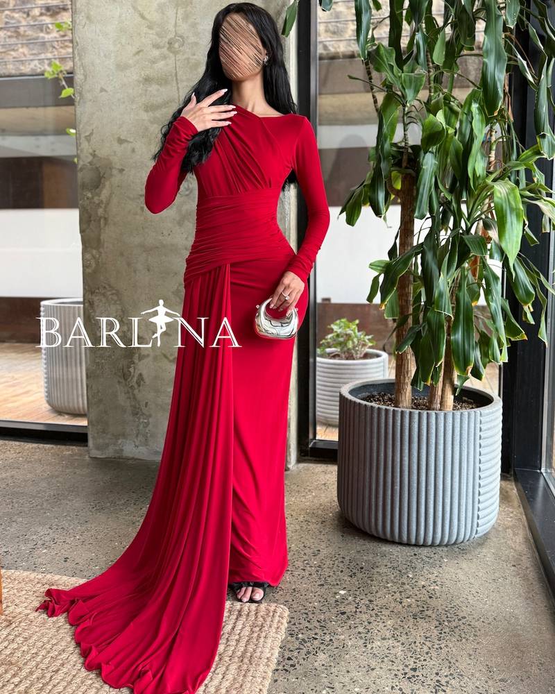 Long red draped dress with an extended tail