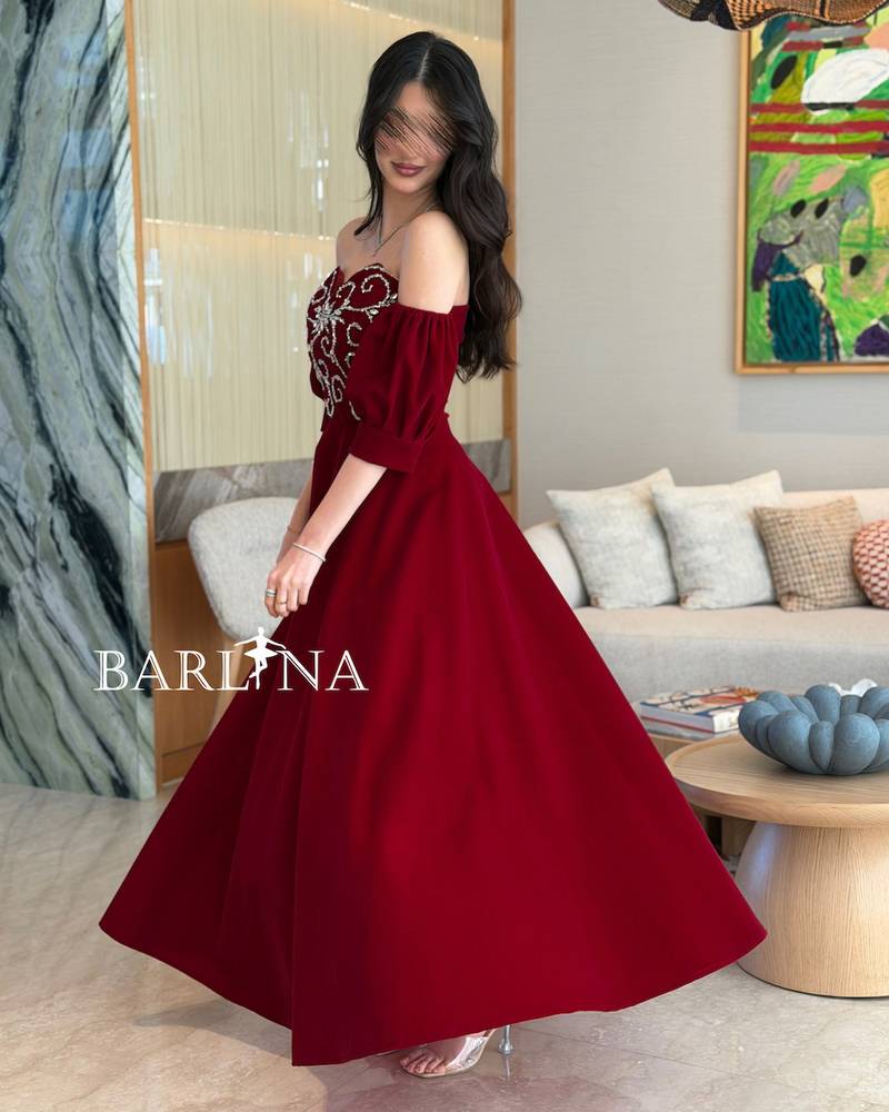 Burgundy dress with silver embroidery on the bodice