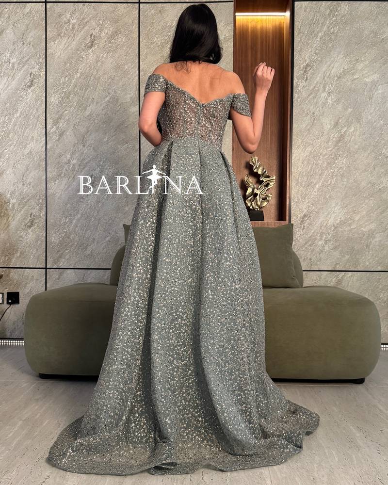 Luxurious evening dress with a beaded back train