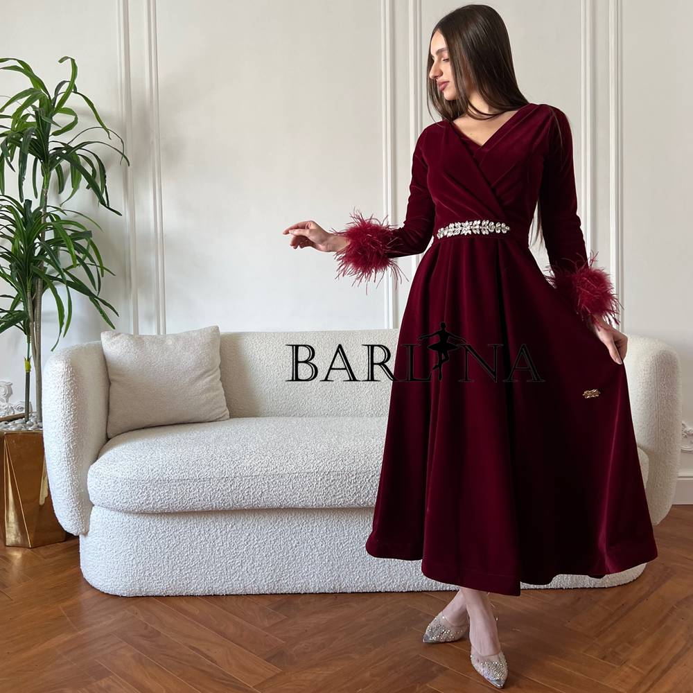 Burgundy velvet dress with feathers