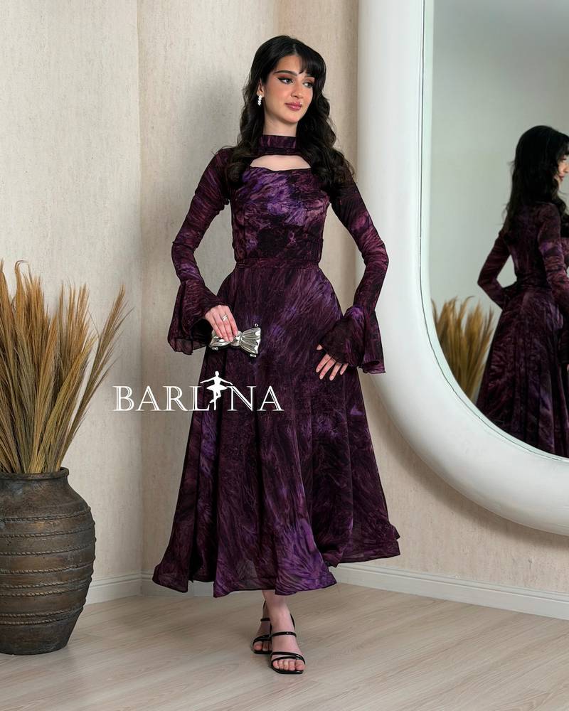 Purple dress with long sleeves and a plunging neckline
