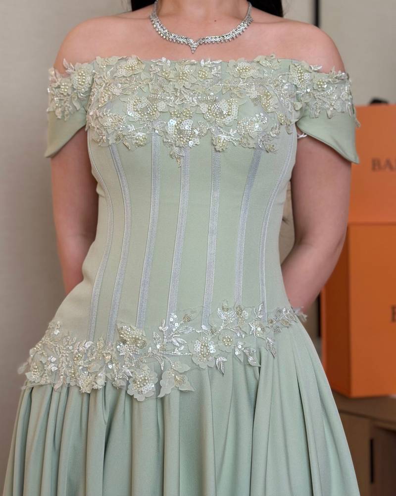 Luxurious light green off-the-shoulder evening dress