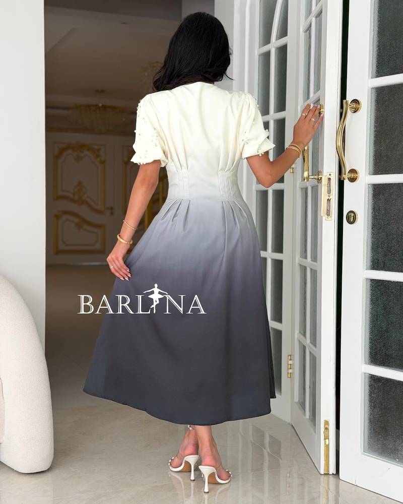 A gray-toned dress with a defined waist and front buttons.