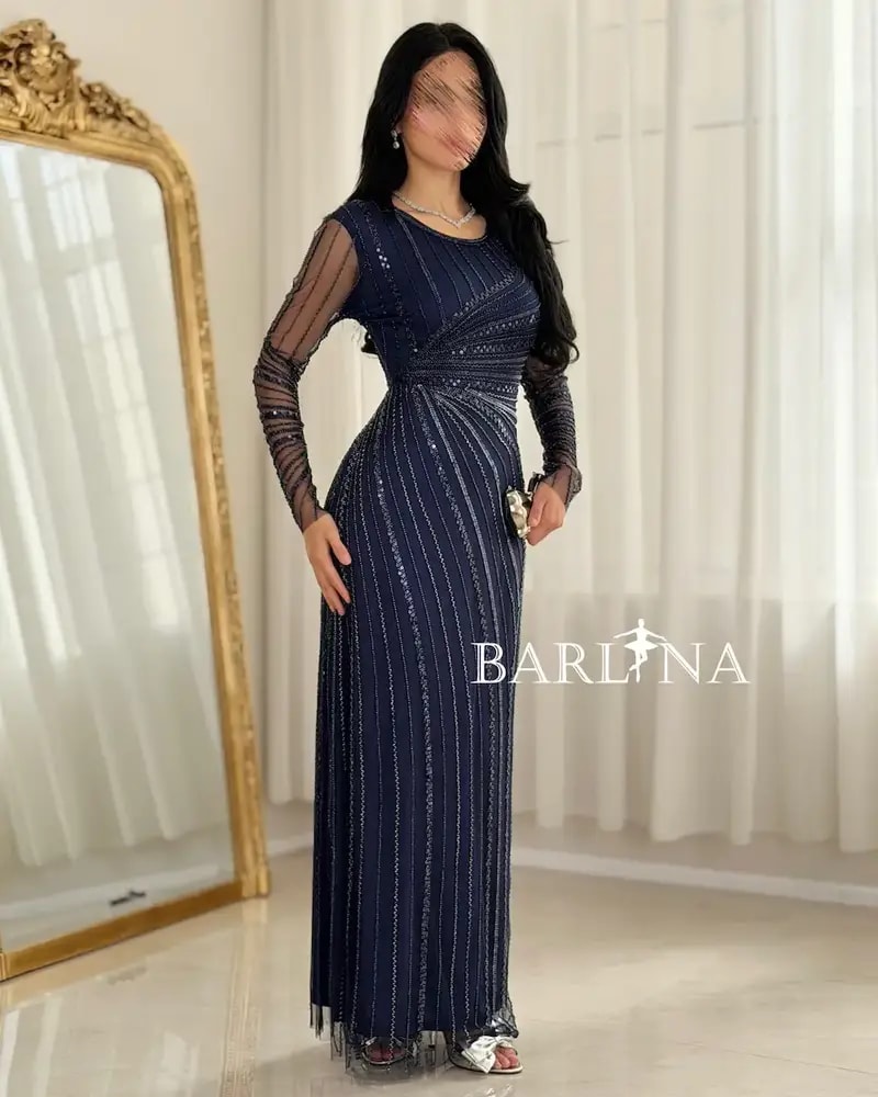 Elegant evening dress adorned with shimmering embroidery lines