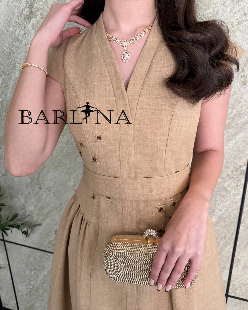 Elegant brown dress with simple embroidery on the waist