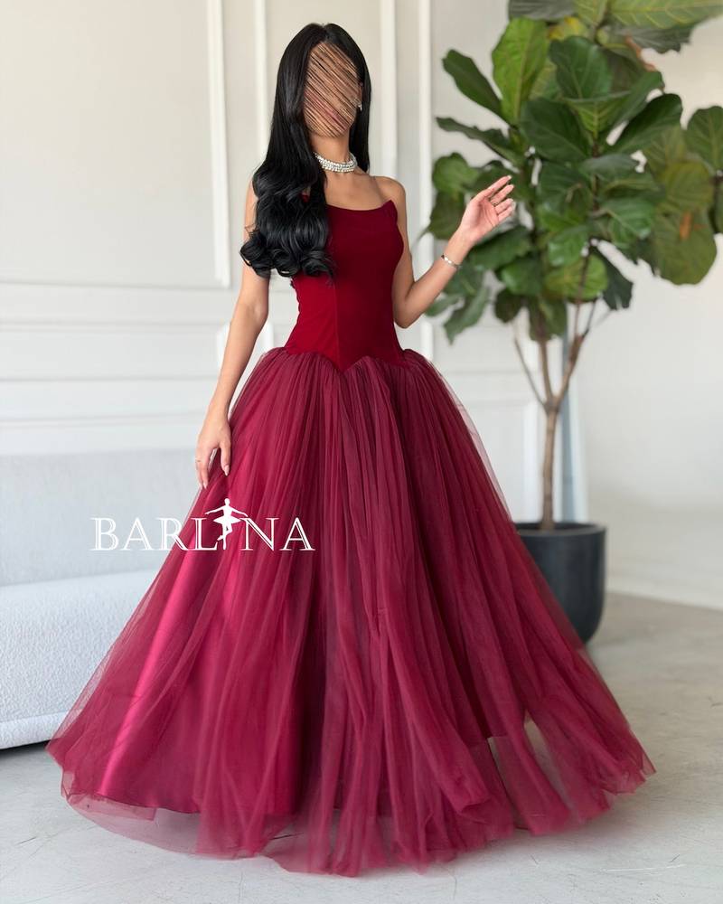 A burgundy puffy dress with a simple corset