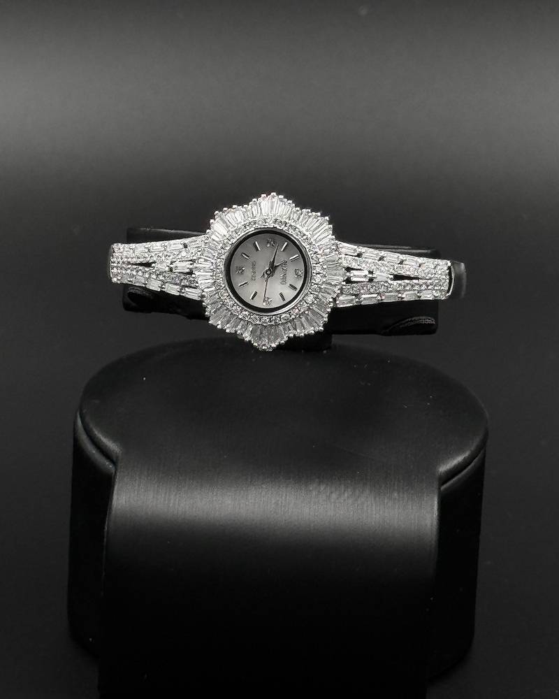 Uniquely designed watch studded with long stones