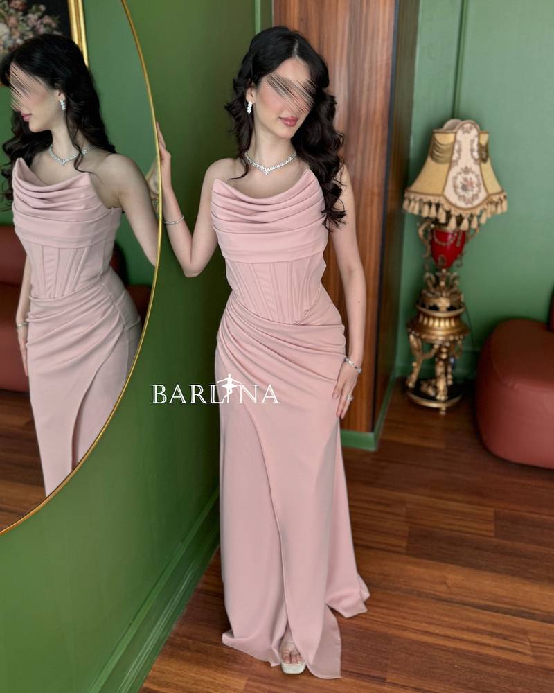 A pink dress with delicate details and elegant pleats
