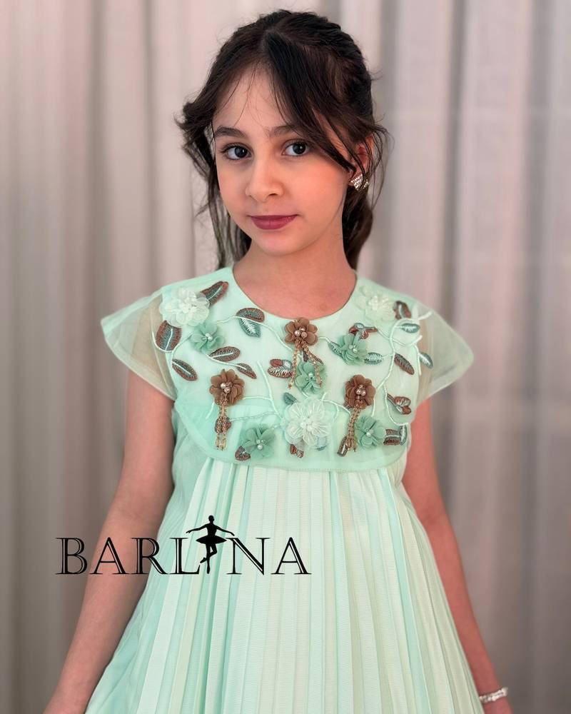 A soft girl's dress with floral embroidery