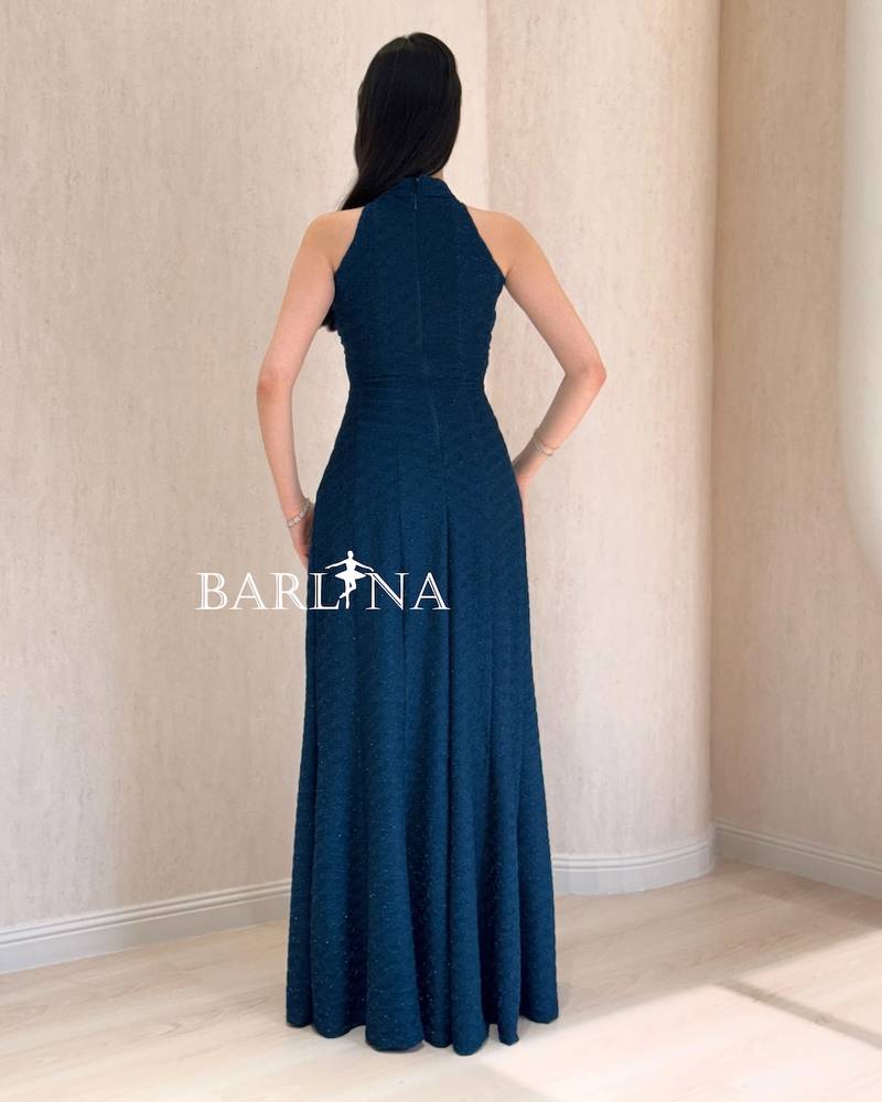 Long petrol blue halter dress with crisscross cut