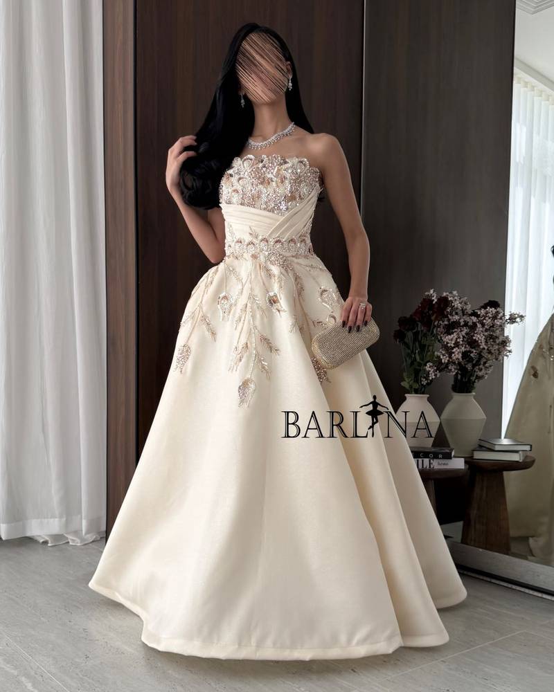 Beige evening dress with gold embroidery