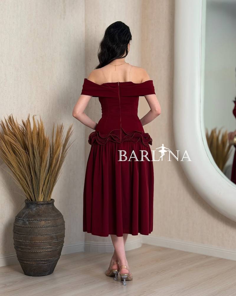 Burgundy dress with ruffles at the waist