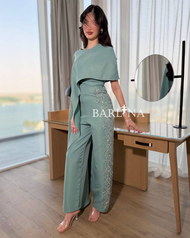 Tiffany jumpsuit with a side cape and shimmering embroidery