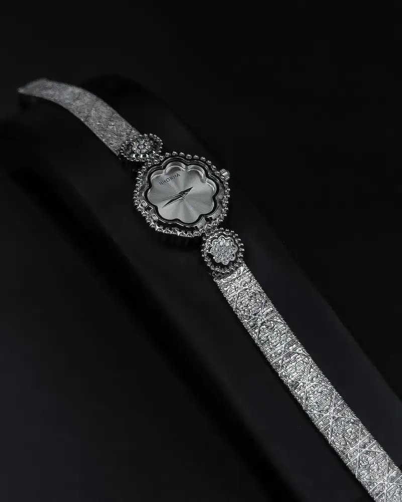 A delicate women's watch with an elegant floral design
