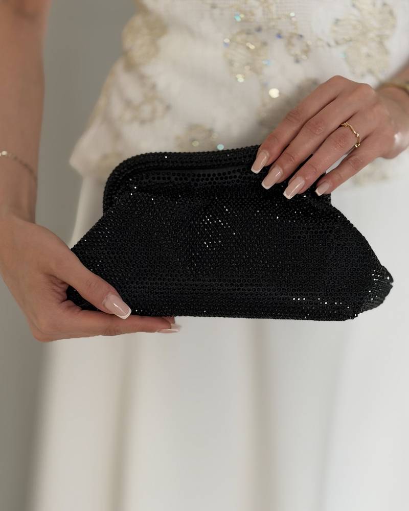 Elegant black handbag studded with rhinestones