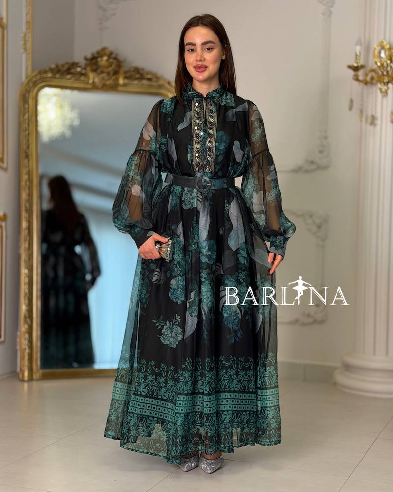 Long black dress with a green pattern