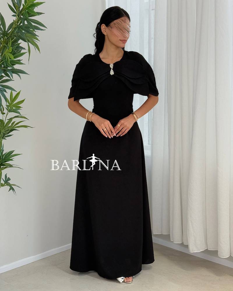 A soft black dress with crystal detailing